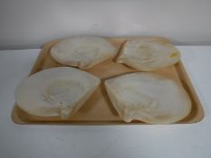 Four mother of pearl shell dishes
