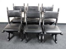 A set of six dining chairs on X frame supports