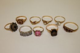 A collection of 9 gold rings, 20.