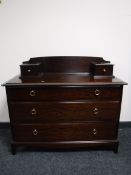 A Stag Minstrel three drawer chest in a mahogany finish