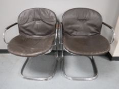 A pair of mid 20th century chrome and brown leather armchairs