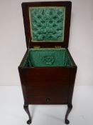 An early 20th century mahogany sewing box on Queen Anne legs