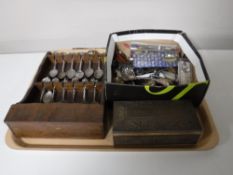 A tray of crested tea spoons, baby spoon,