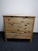 A pine three drawer chest