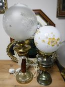 A converted oil lamp with shade, a floor lamp and table lamp, rug,