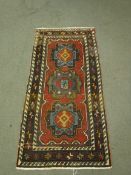 An antique Caucasian Kazak rug