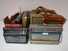 A box containing eight mid twentieth century radios