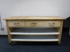 A contemporary Ikea pine topped kitchen preparation table fitted with three drawers and shelves