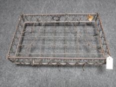 A metal hanging kitchen pan rack