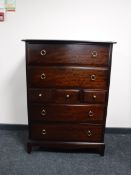 A Stag Minstrel seven drawer chest in a mahogany finish
