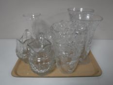 A tray containing assorted glassware, including vases, fruit bowls,