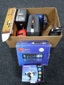 A box containing cameras and camera equipment, car stereo, chess pieces,