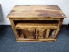 A mango wood entertainment stand