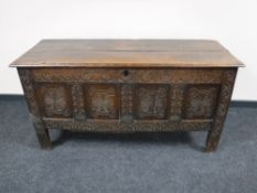 An 18th century and later panelled oak coffer
