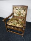 An early 20th century oak armchair