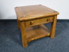 A contemporary two-tier lamp table fitted a drawer