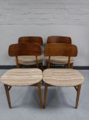A set of four mid twentieth century teak Beautility dining chairs