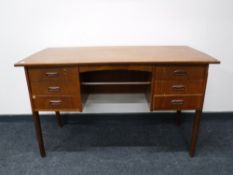A mid 20th century teak desk