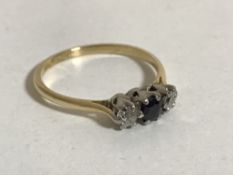 An 18ct gold sapphire and diamond ring