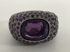 An 18ct white gold and amethyst cluster ring, 16.