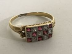 An 18ct gold ruby and diamond ring, size O.