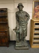 A patinated bronze figure, The Blacksmith,