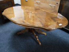 An Italianate pedestal coffee table