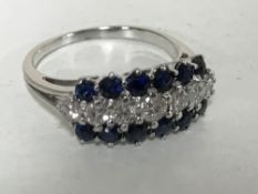 An 18ct white gold sapphire and diamond ring
