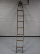A set of vintage wooden fruit picker's ladders