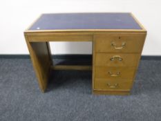A mid twentieth century leather topped writing desk,