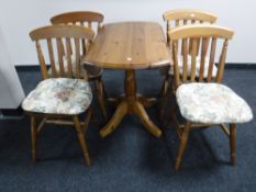 A pine pedestal drop leaf kitchen table,