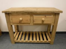 A reclaimed pine kitchen preparation table,