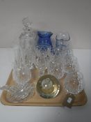 A tray containing a cut glass whiskey decanter with stopper, two blue glass water jugs,