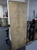 A folding industrial trestle table