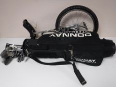 A Donnay golf bag and assorted drivers,