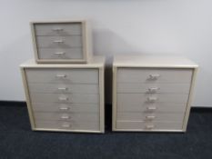 A pair of contemporary six drawer chests, together with a matching three drawer bedside chest,