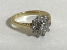 An 18ct gold diamond cluster ring