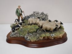 A Border Fine Arts figure; 'The Crossing', Shepherd, sheep and collie,