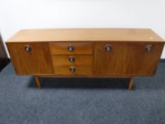 A mid twentieth century teak cocktail sideboard