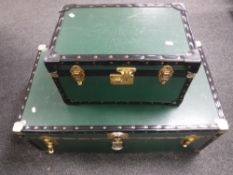 Two graduated cabin trunks