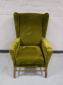 A mid twentieth century wingback armchair,