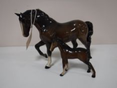 Two Beswick figures, foal and horse with front foot raised,