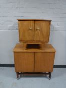 A teak double door cocktail cabinet,