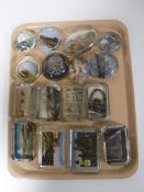 A tray of sixteen early/mid 20th century glass tourist paperweights
