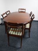 A mahogany Regency style pedestal dining table, together with six chairs, two carvers,