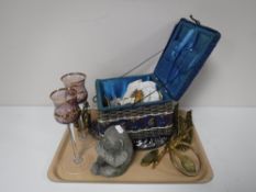 A tray containing brass ornaments, vintage sewing box, glass skull plate,