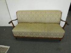 A mid 20th century wood framed settee in gold brocade