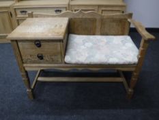A 20th century blonde oak telephone table