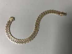 A three-tone 9ct gold bracelet, 11.6g.