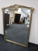 A contemporary gilded overmantel mirror